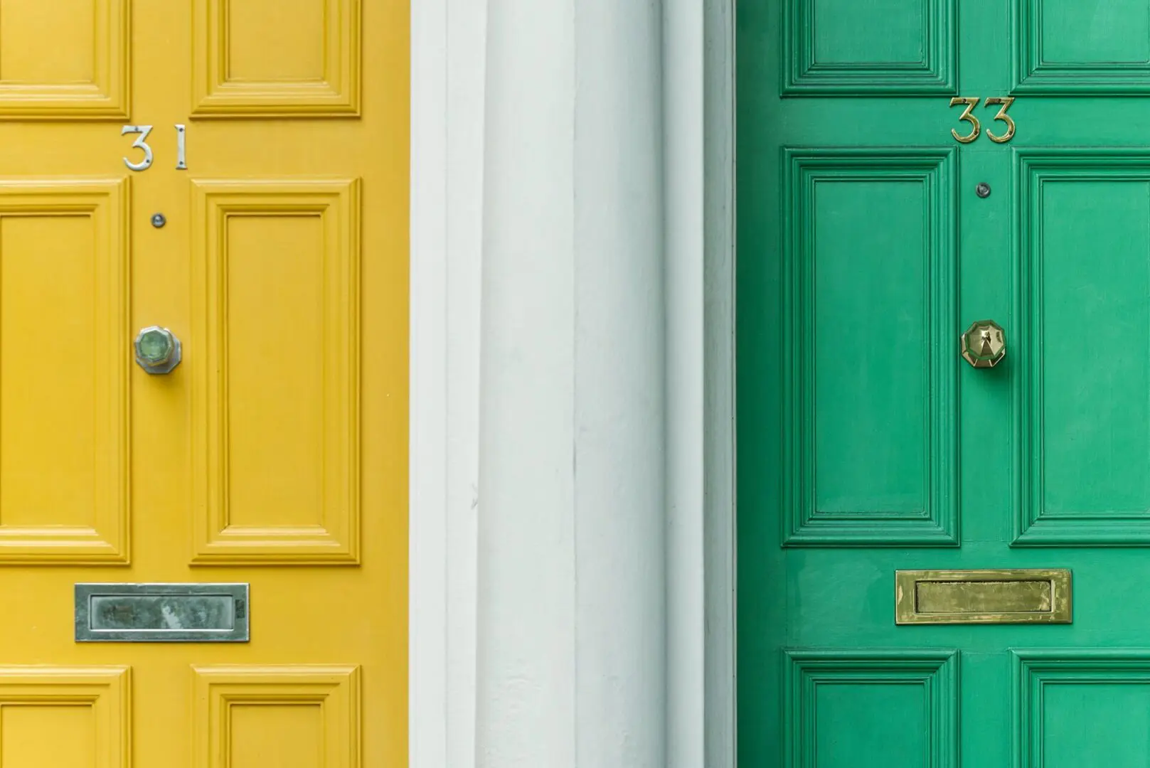 Two neighboring houses with a yellow door and a green door, symbolizing different investment strategies and financial paths.