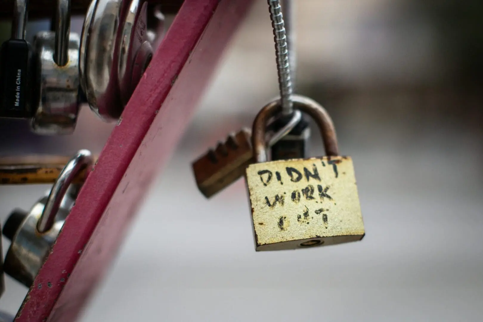 Close-up of a padlock labeled "Didn't work out," symbolizing failed financial advice and lack of proper planning.