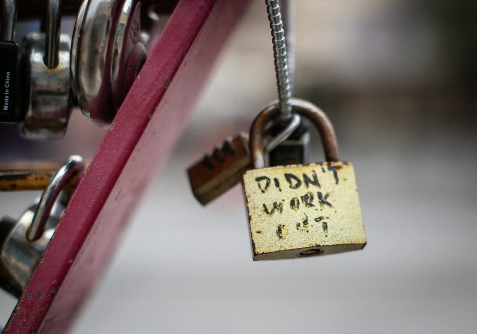 Close-up of a padlock labeled "Didn't work out," symbolizing failed financial advice and lack of proper planning.